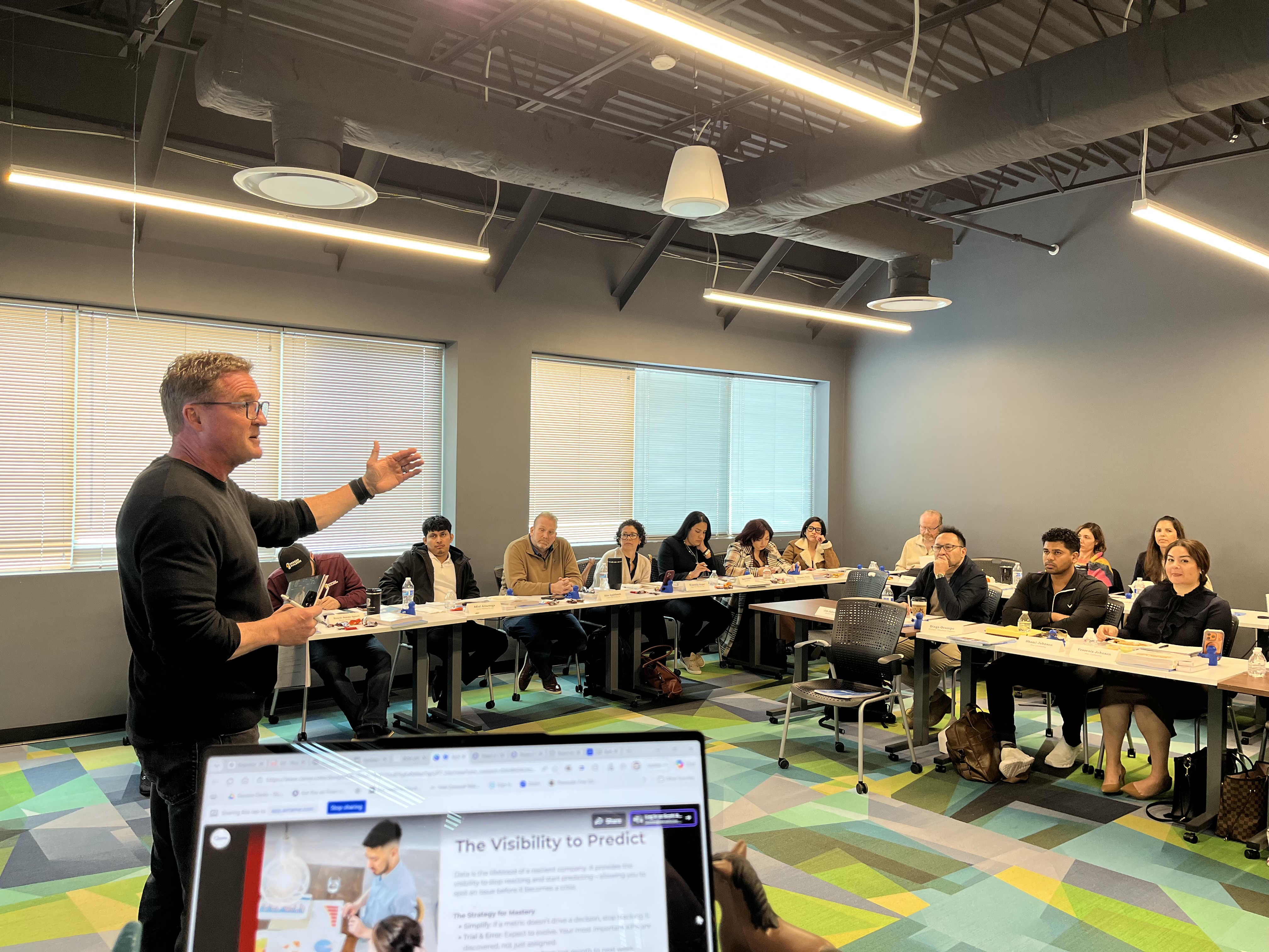 Scott Abbott presenting to professionals in a classroom workshop setting