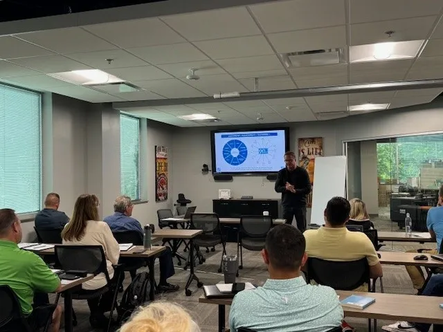 Scott Abbott leading a training session with a group